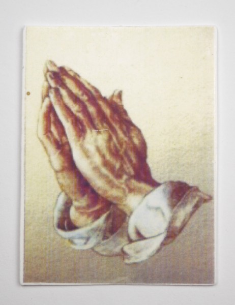 Wachsbild mit betende Hände